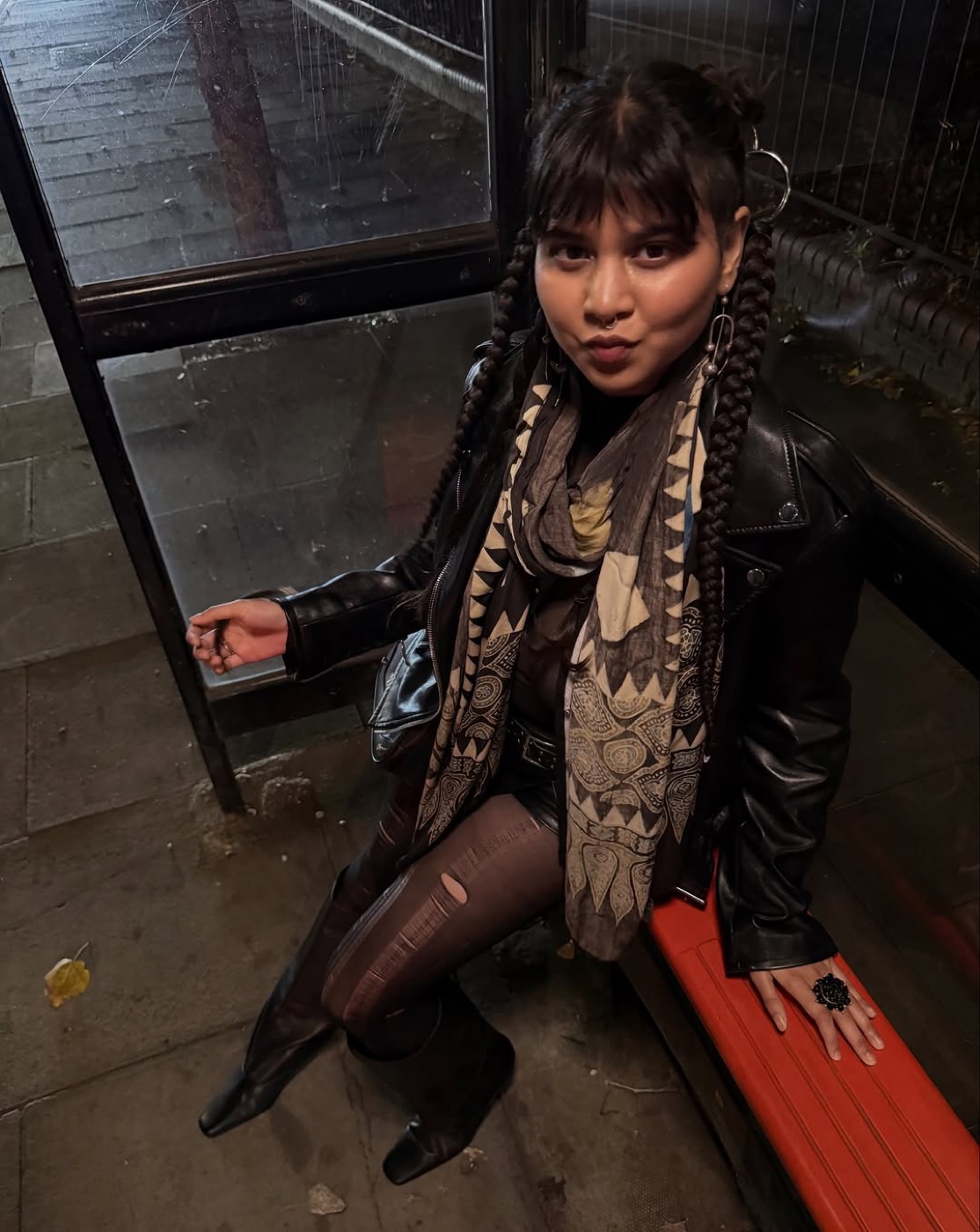 Prerna Singh at night in a leather jacket and braids